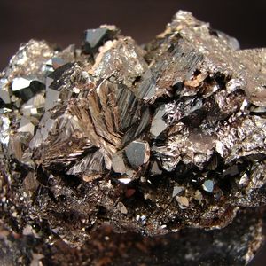 A hematite specimen with a copper hue and sparkling facets.