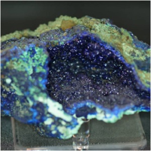 An azurite stone with little beads of light and dark blue azurite crystal.