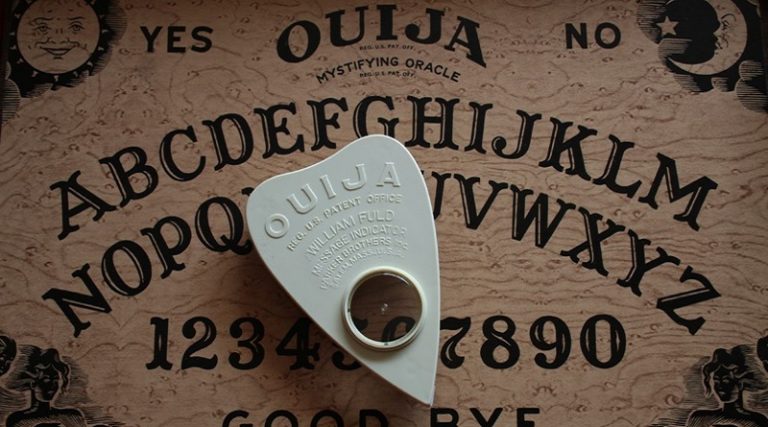 A Ouija Board and planchette.