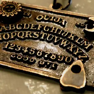 A Ouija board molded into metal.