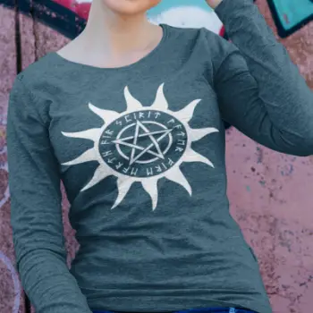 A heather deep teal long sleeve tee with a pentacle graphic encircled by sun rays and elder futhark runes.