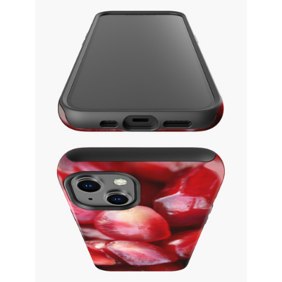 A top view of an iPhone 13 decorated with our Pomegranate Seeds Tough Case.