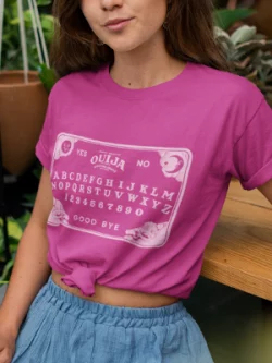 A woman wearing a Berry Pink T Shirt from Elune Blue on Etsy.
