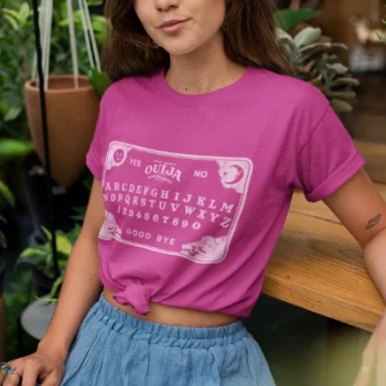 A woman wearing a Berry Pink T Shirt from Elune Blue on Etsy.