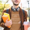 A man wearing a toast brown Ouija T-Shirt from Elune Blue on Etsy.