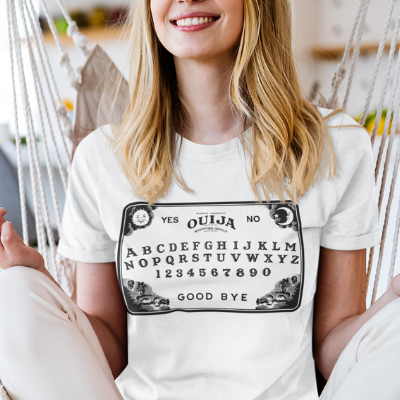A woman wearing a White Ouija T-Shirt from Elune Blue on Etsy.