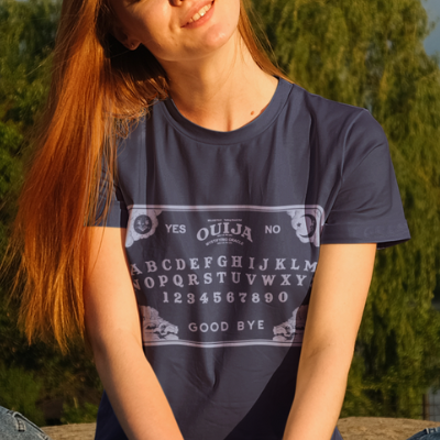 A woman wearing a Navy Blue Ouija T-Shirt from Elune Blue on Etsy