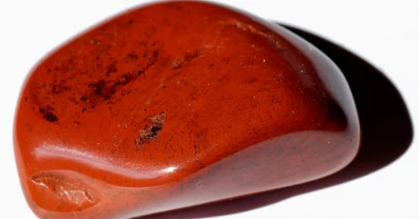 Close-up on a smooth Red Jasper stone.