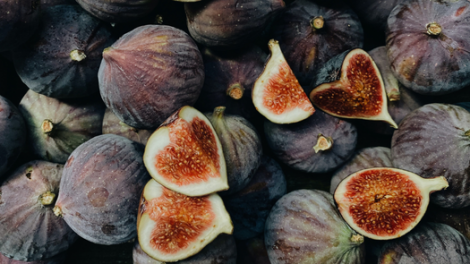 Close-up Shot of whole and sliced figs.