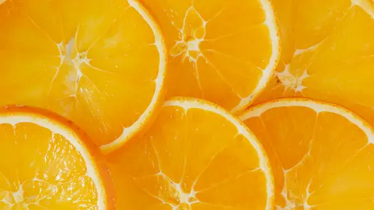 Close-up of cascading orange slices.