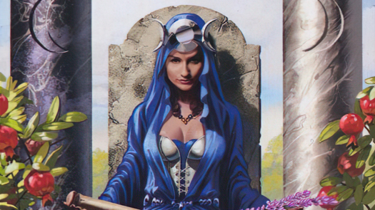 A woman wearing a triple goddess crown, dressed in blue, holding a branch with purple flowers in her lap, sitting on a stone throne near pomegranate trees, flanked by pillars with crescent moons engraved on them.